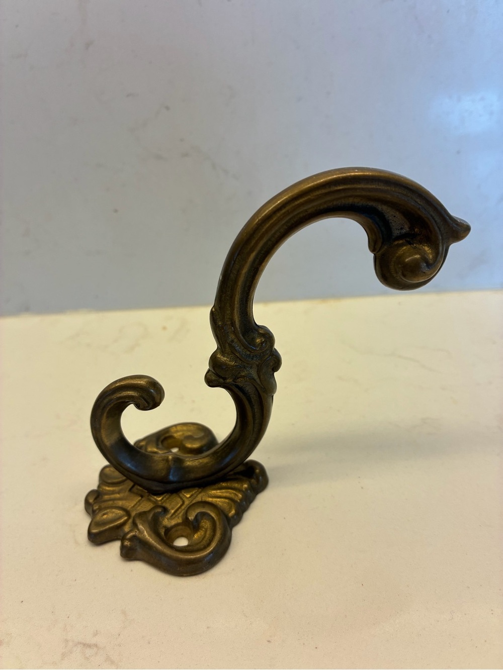 Vintage Italian solid brass wall hook. 
2.5 x 5 in